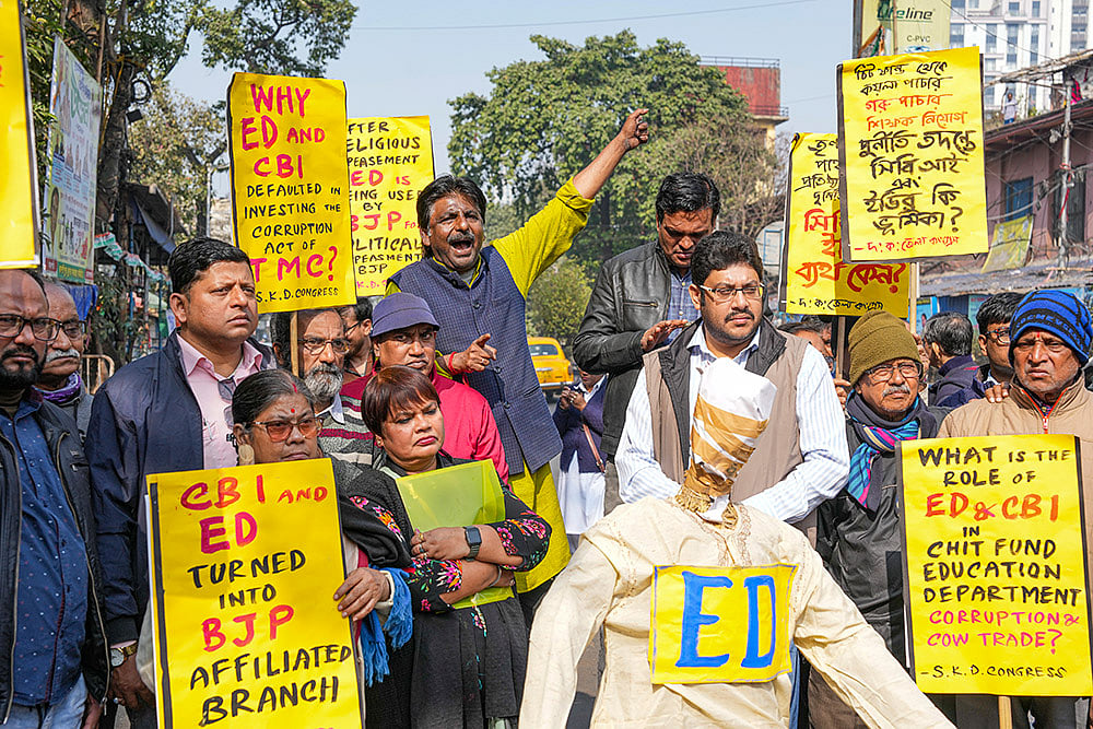 | Photo: PTI/Swapan Mahapatra : Kolkata: Congress activists hold placards during a protest against the Central and State governments over the alleged misuse of central agencies, in Kolkata.