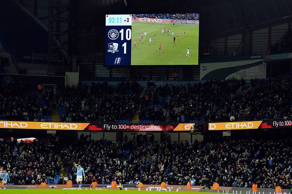 | Photo: Nick Potts/PA via AP : The scoreboard displays the 10-1 scoreline during the FA Cup third round match between Manchester City and Exeter in Manchester, England.