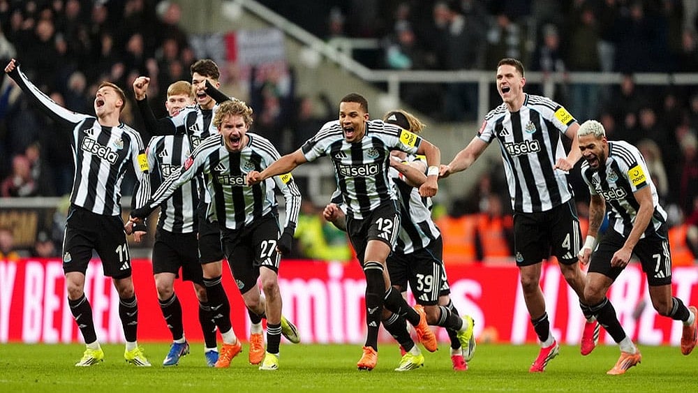 | Photo: Owen Humphreys/PA via AP : Newcastle United players celebrate winning the penalty shoot-out after the FA Cup third round soccer match between Newcastle United and Bournemouth in Newcastle, England.