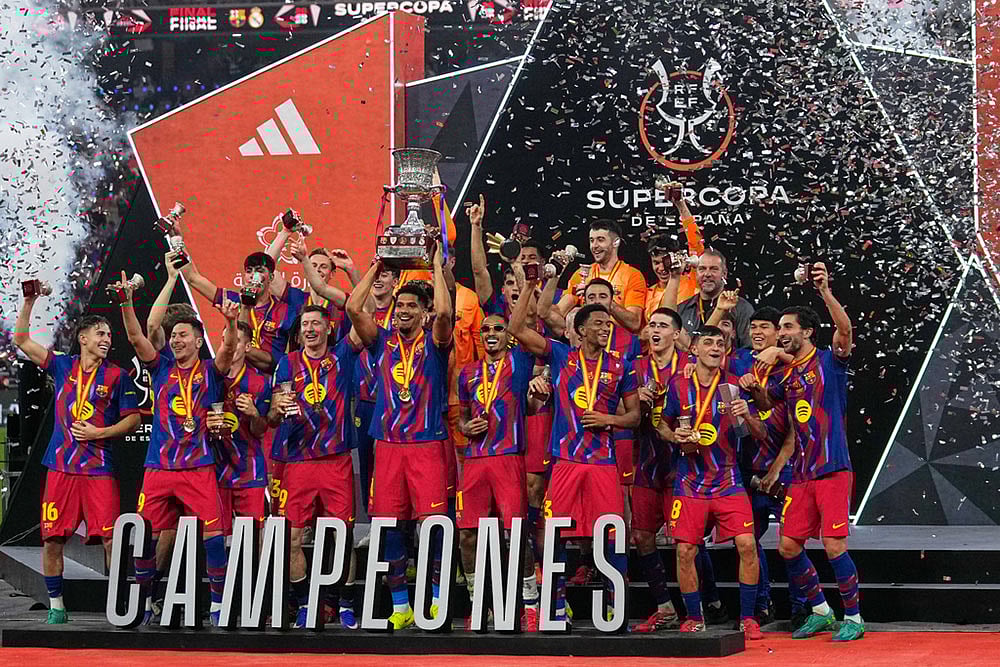 | Photo: AP/Altaf Qadri : Barcelona players celebrate after winning the Spanish Super Cup final soccer match against Real Madrid at King Abdullah Sports City Stadium in Jeddah, Saudi Arabia.