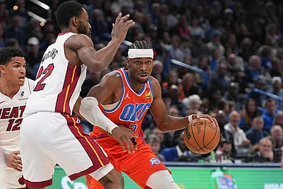 | Photo: AP/Kyle Phillips : Oklahoma City Thunder guard Shai Gilgeous-Alexander, right, pushes past Miami Heat forward Andrew Wiggins during the second half of an NBA basketball game in Oklahoma City.