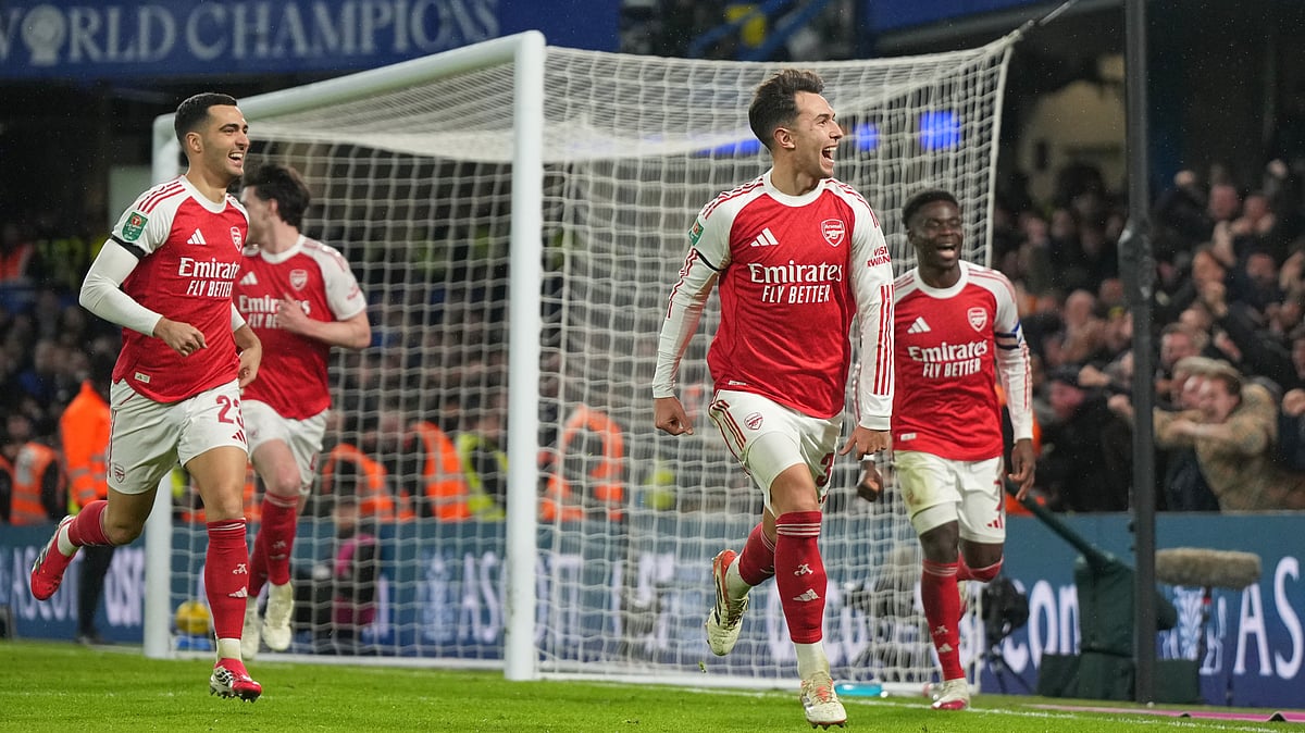 (AP Photo/Alastair Grant) : Arsenals Martin Zubimendi celebrates after scoring his sides third goal during the English League Cup semifinal first leg soccer match between Chelsea and Arsenal in London, Wednesday, Jan. 14, 2026.