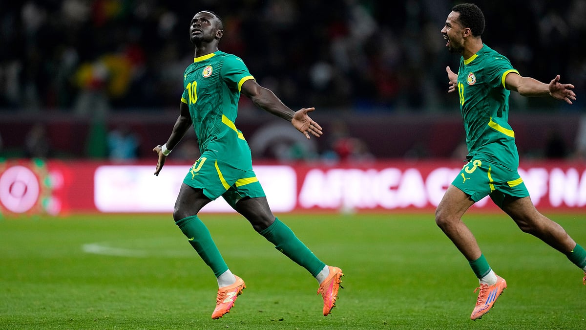 | Photo: AP/Themba Hadebe : Senegal's Sadio Mane celebrates after scoring his side's opening goal during  the Africa Cup of Nations semifinal match against Egypt on Wednesday, January 14, 2026.