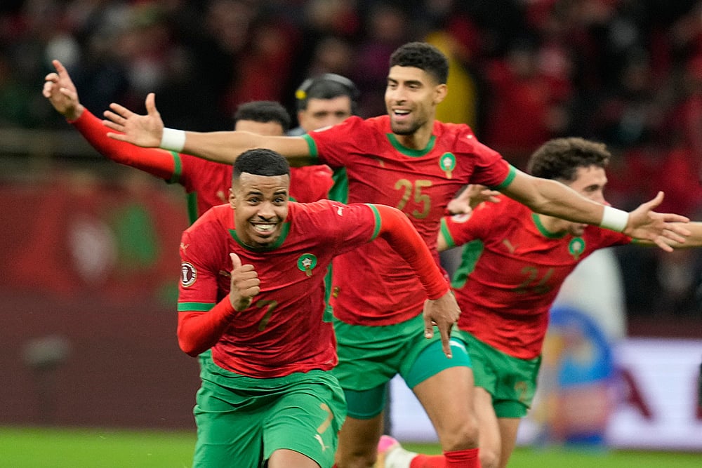 | Photo: AP/Mosaab Elshamy : Morocco players celebrate after winning after a penalty shootout during the Africa Cup of Nations semi-final match between Nigeria and Morocco in Rabat, Morocco.