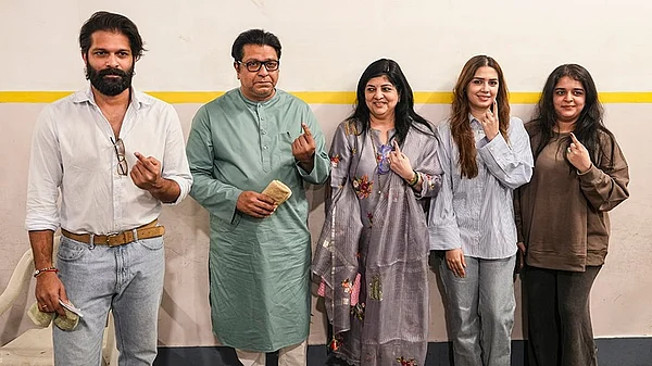 | Photo: PTI/Kunal Patil : Maharashtra Navnirman Sena (MNS) chief Raj Thackeray with party leader and his son Amit Thackeray and other family members, shows his ink-marked finger after casting a vote in the Brihanmumbai Municipal Corporation (BMC) polls, in Mumbai.