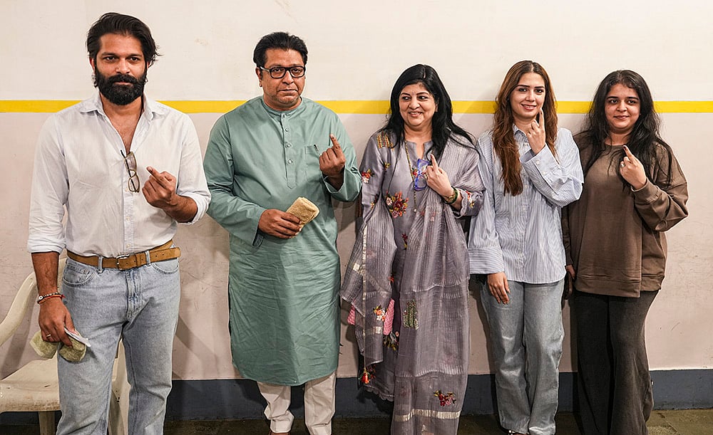 | Photo: PTI/Kunal Patil : Maharashtra Navnirman Sena (MNS) chief Raj Thackeray with party leader and his son Amit Thackeray and other family members, shows his ink-marked finger after casting a vote in the Brihanmumbai Municipal Corporation (BMC) polls, in Mumbai.