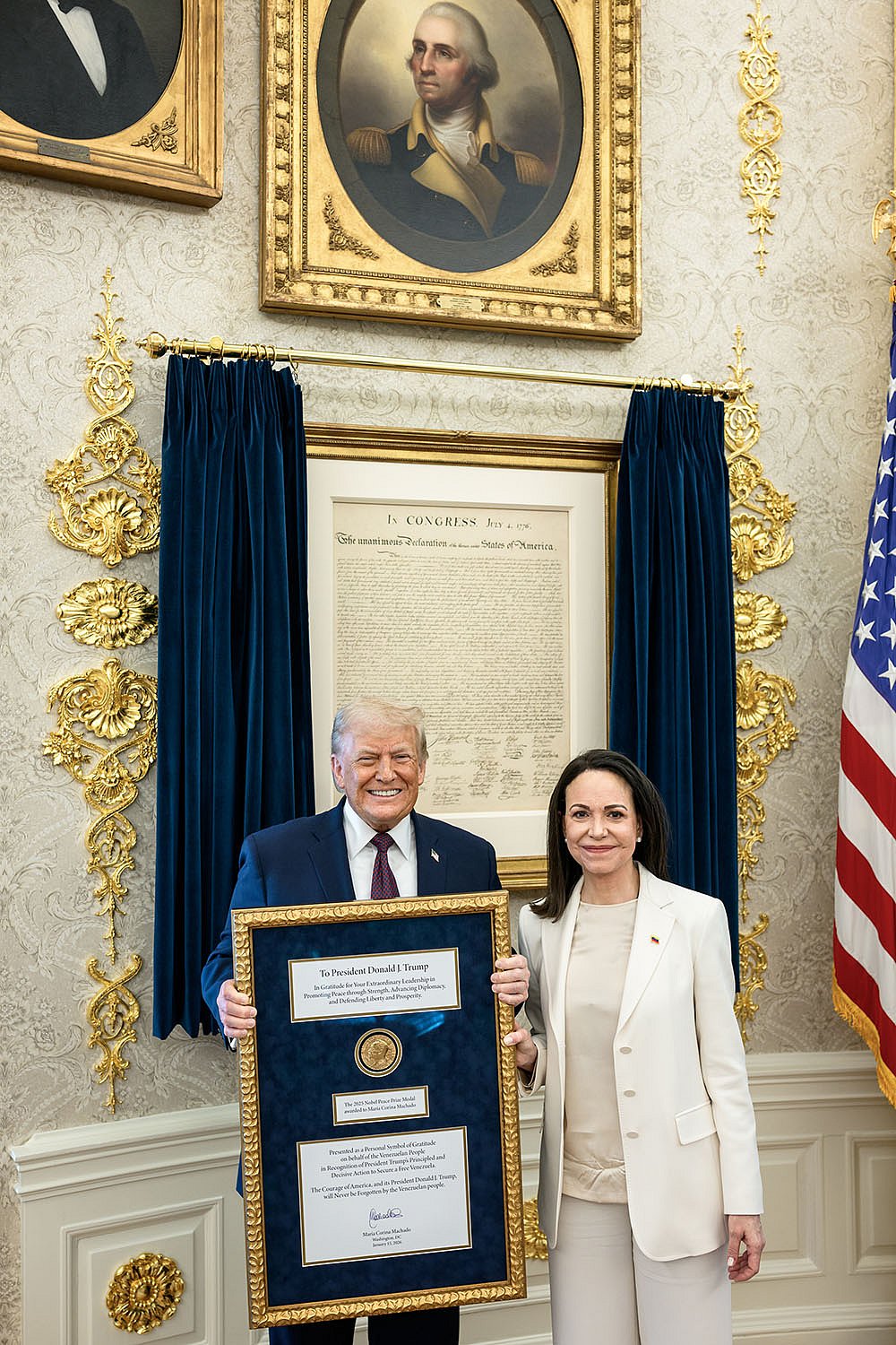 | Photo: @WhiteHouse/X via PTI  : Venezuelan opposition leader María Corina Machado presents her Nobel Peace Prize to US President Donald Trump during a meeting at the Oval Office, in Washington, DC. Machado, who has on previous occasions said that she would give her Nobel prize to Trump, met the American President in the White House Thursday, a closely-watched meeting that came days after the US carried out a military strike in Venezuela and captured its leader Nicolás Maduro. 