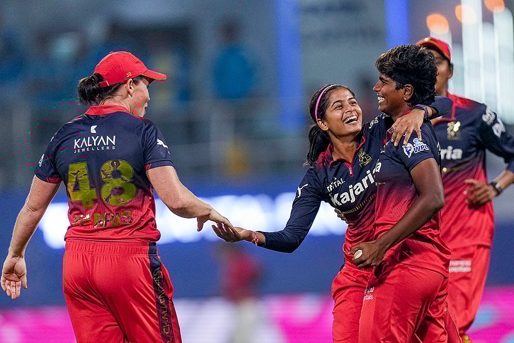 | Photo: PTI/Kunal Patil : Royal Challengers Bengaluru players celebrate their victory during the Womens Premier League (WPL) T20 cricket match between Royal Challengers Bengaluru and Gujarat Giants, at the DY Patil Stadium, in Navi Mumbai.
