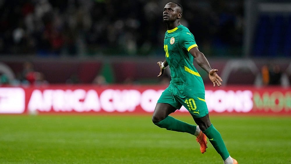 | Photo: AP/Themba Hadebe : Senegal's Sadio Mane celebrates after scoring his side's opening goal during the Africa Cup of Nations semifinal soccer match between Senegal and Egypt, in Tangier, Morocco.