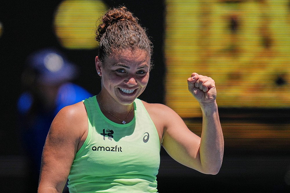 | Photo: AP/Dita Alangkara : Jasmine Paolini of Italy celebrates after defeating Aliaksandra Sasnovich of Belarus in their first round match at the Australian Open tennis championship in Melbourne, Australia