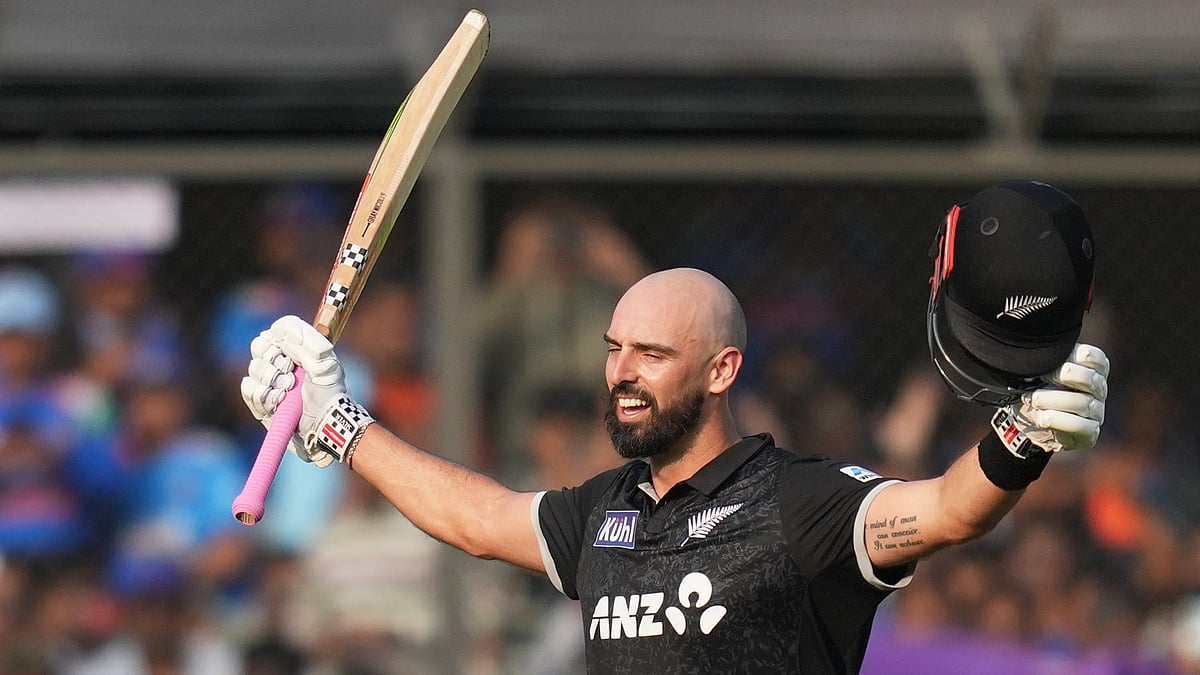 (AP Photo/Rafiq Maqbool) : New Zealands Daryl Mitchell celebrates his century during the third One Day International cricket match between India and New Zealand in Indore, India, Sunday, Jan. 18, 2026