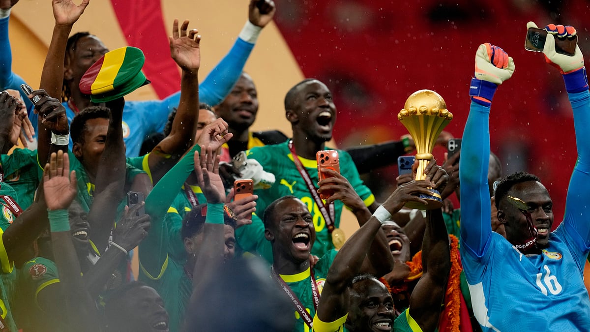 (AP Photo/Themba Hadebe) : Senegal players celebrate as they win the Africa Cup of Nations final soccer match between Senegal and Morocco, in Rabat, Morocco, Sunday, Jan. 18, 2026.