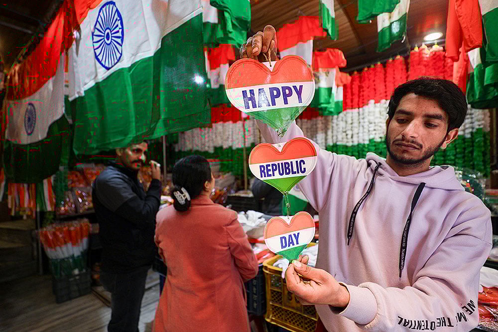 | Photo: PTI : A shopkeeper displays tricolour-themed items for sale ahead of Republic Day, in Jammu.