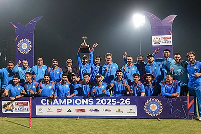 | Photo: PTI/Shailendra Bhojak : Vidarbhas players pose with the trophy after winning the Vijay Hazare Trophy 2025-26, at BCCI Centre of Excellence, in Bengaluru, Karnataka.