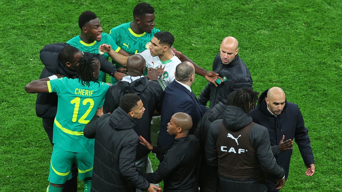 | Photo: AP/Youssef Loulidi : Morocco's Achraf Hakimi, center, clashes with Senegal players after a controversial penalty was awarded to Morocco late on during the Africa Cup of Nations final soccer match between Senegal and Morocco in Rabat, Morocco, Sunday, Jan. 18, 2026.