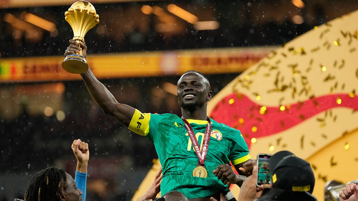| Photo: AP/Mosaab Elshamy : Senegals Sadio Mane holds the trophy aloft after winning the Africa Cup of Nations final soccer match agaisnt Morocco, in Rabat, Morocco, Sunday, Jan. 18, 2026.