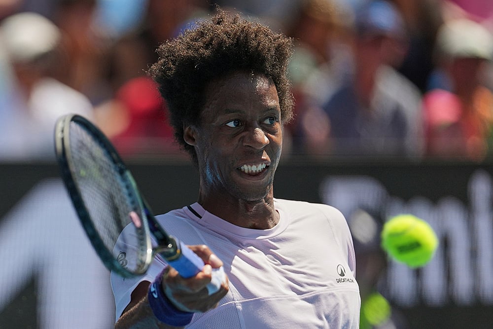 | Photo: AP/Dita Alangkara : Gael Monfils of France plays a forehand return to Dane Sweeny of Australia during their first round match at the Australian Open tennis championship in Melbourne, Australia.
