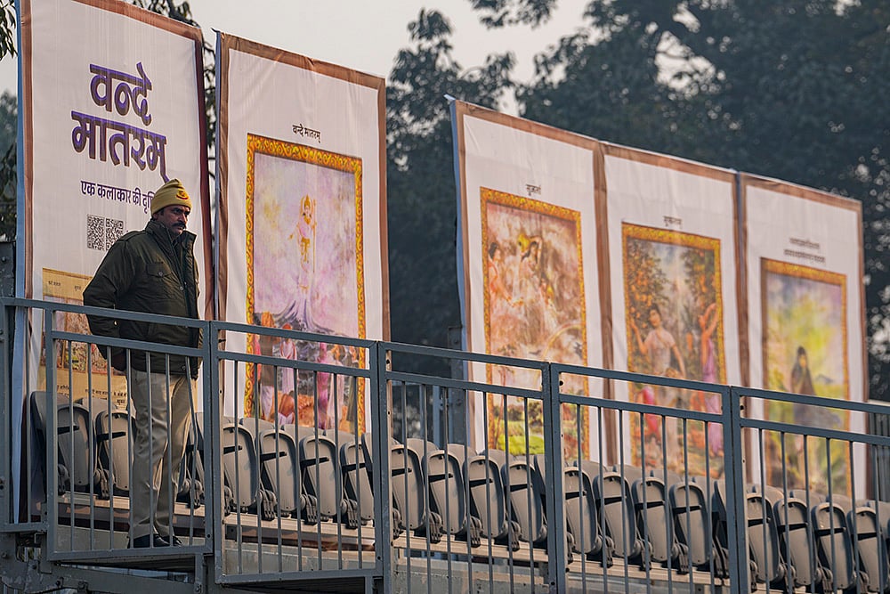 | Photo: PTI/Kamal Kishore : A police official stands guard near standees during rehearsals for the Republic Day Parade on a cold winter morning, in New Delhi. The sesquicentenary of Vande Mataram will be the dominant theme of this years parade, with enclosure backdrops along the Kartavya Path displaying old paintings illustrating the opening stanzas of the National Song and floral artworks at the main stage paying homage to its composer Bankim Chandra Chatterjee. 