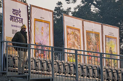 | Photo: PTI/Kamal Kishore : A police official stands guard near standees during rehearsals for the Republic Day Parade on a cold winter morning, in New Delhi. The sesquicentenary of Vande Mataram will be the dominant theme of this years parade, with enclosure backdrops along the Kartavya Path displaying old paintings illustrating the opening stanzas of the National Song and floral artworks at the main stage paying homage to its composer Bankim Chandra Chatterjee.