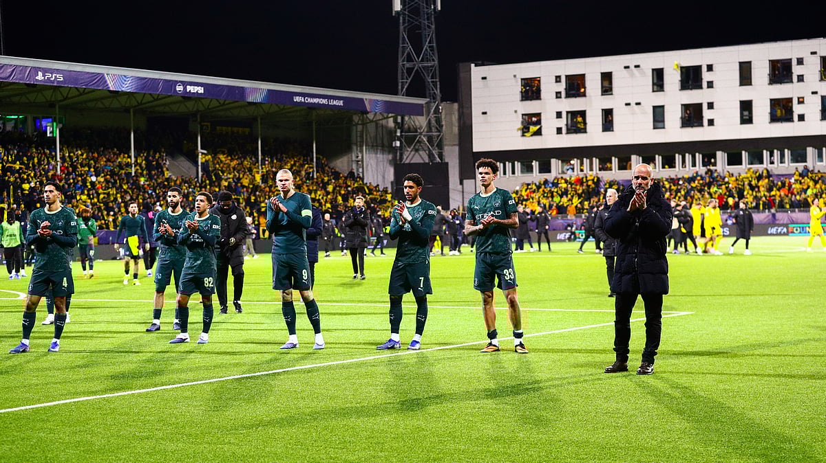 | Photo: NTB/Mats Torbergsen via AP : Manchester City's Erling Haaland, center, and head coach Pep Guardiola, right, applaud the crowd after the Champions League soccer match between Bodo/Glimt and Manchester City in Bodo, Norway, Tuesday, Jan. 20, 2026.