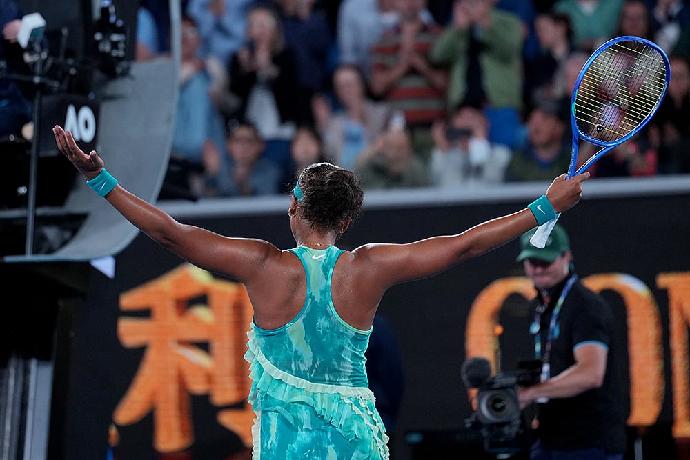 | Photo: AP/Dita Alangkara : Naomi Osaka of Japan reacts after defeating Sorana Cirstea of Romania in their second round match at the Australian Open tennis championship in Melbourne, Australia.