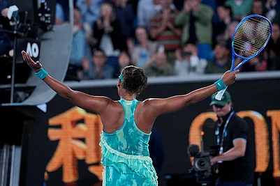| Photo: AP/Dita Alangkara : Naomi Osaka of Japan reacts after defeating Sorana Cirstea of Romania in their second round match at the Australian Open tennis championship in Melbourne, Australia.