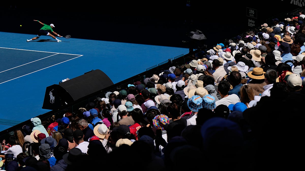 | Photo: AP/Aaron Favila : Novak Djokovic of Serbia plays a backhand return to Francesco Maestrelli of Italy during their second round match at the Australian Open tennis championship in Melbourne, Australia, Thursday, Jan. 22, 2026.