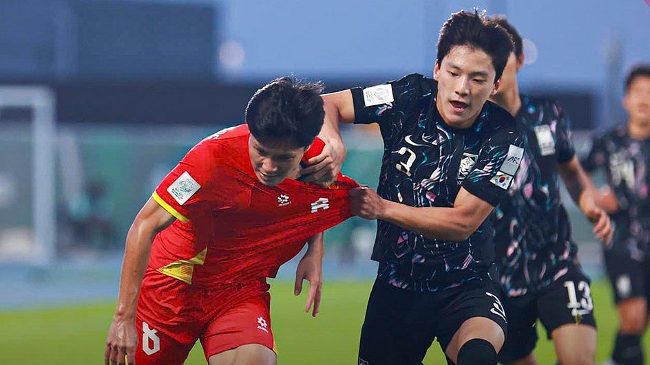 | Photo: Facebook/Vietnam Football Federation : Vietnams Nguyen Thai Quoc Cuong in action against South Koreas Bae Hyun-Seo during their AFC U23 Asian Cup match on January 23, 2026.