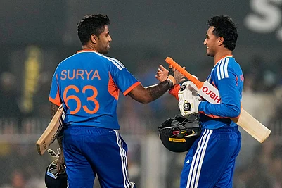 Photo: AP/Anupam Nath : Indias captain Suryakumar Yadav, left, and Indias Abhishek Sharma celebrate after winning the third T20 cricket match between India and New Zealand in Guwahati, India.