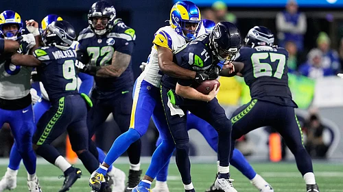 AP : Seattle Seahawks quarterback Sam Darnold (14) is sacked by Los Angeles Rams safety Kamren Kinchens during the second half of the NFC Championship NFL football game.