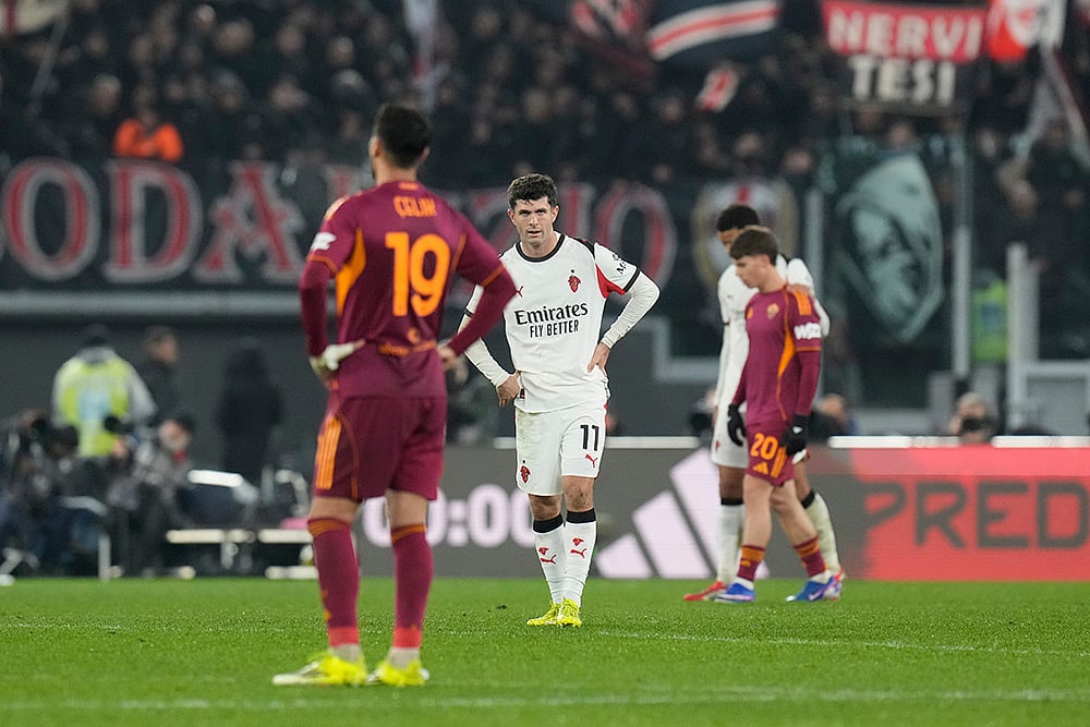 | Photo: AP/Gregorio Borgia : AC Milans Christian Pulisic, centre, and Romas Zeki Celik react after the Serie A soccer match between Roma and AC Milan in Rome.