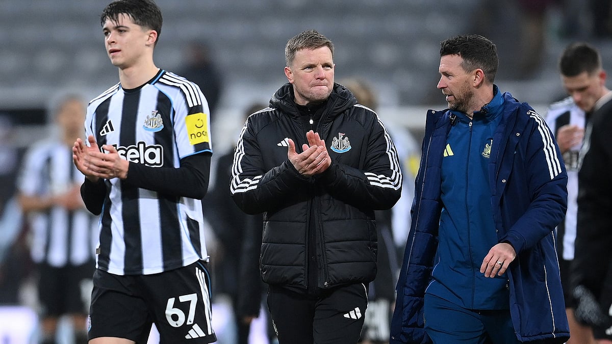 Newcastle United manager Eddie Howe with player Lewis Miley.