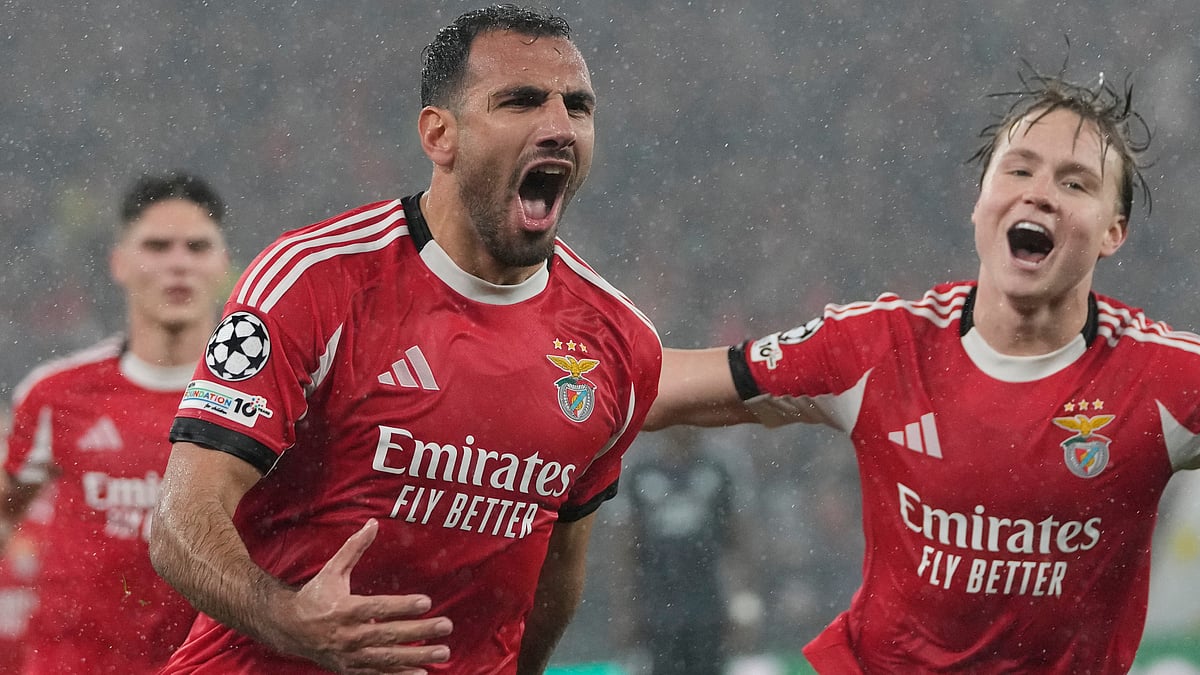 | Photo: AP/Armando Franca : Benfica's Vangelis Pavlidis celebrates after scoring his side's second goal during a Champions League opening phase match against Real Madrid, in Lisbon, Wednesday, Jan. 28, 2026. 