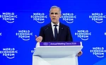 Sean Kilpatrick/The Canadian Press via AP : Canada Prime Minister Mark Carney delivers a speech at the World Economic Forum in Davos, Switzerland on Tuesday, Jan. 20, 2026.