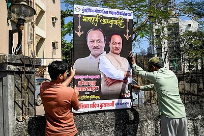 | Photo: PTI : Workers set up a condolence banner following the passing away of Maharashtra Deputy Chief Minister Ajit Pawar, in Mumbai. Pawar, along with four others, was killed after an aircraft carrying them crashed near Baramati.