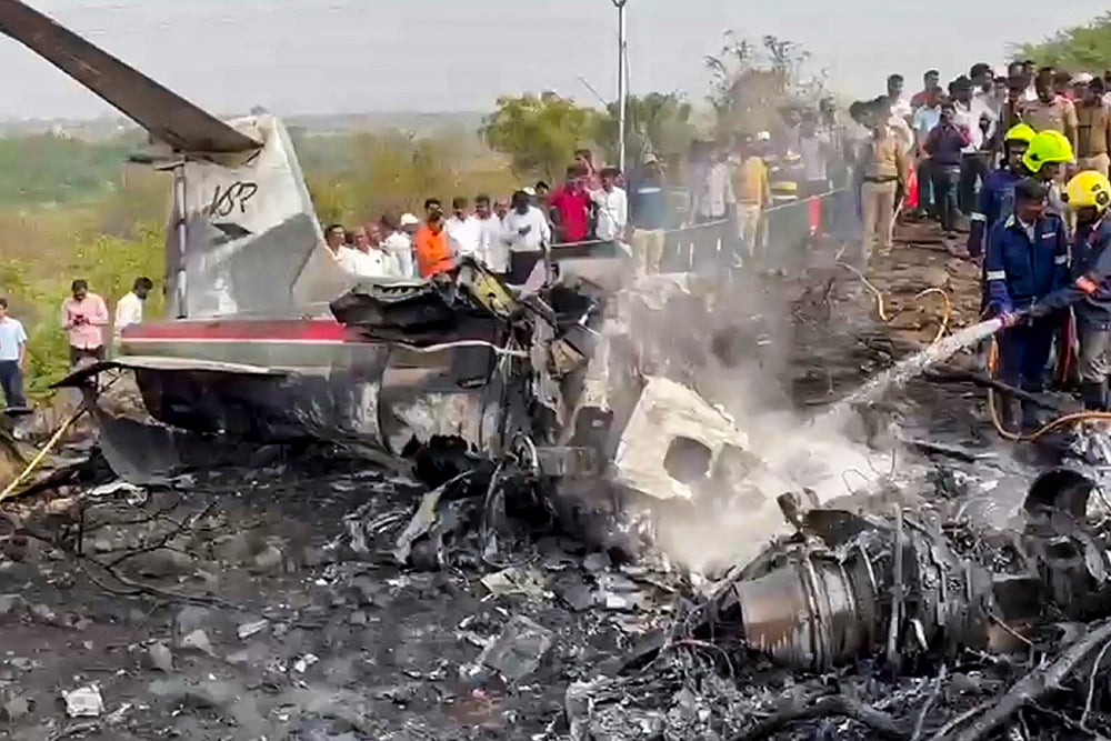 | Photo: PTI : Firefighters at the site after an aircraft carrying Maharashtra Deputy Chief Minister Ajit Pawar crashed during landing, at Baramati in Pune district, Maharashtra.