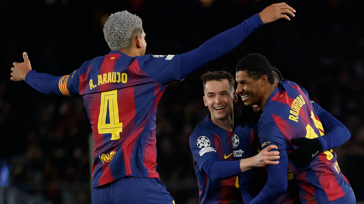 (AP Photo/Joan Monfort) : Barcelona's Marcus Rashford celebrates with team mates his side's fourth goal during the Champions League opening phase soccer match between Barcelona and Copenhagen in Barcelona, Spain, on Wednesday, Jan. 28, 2026