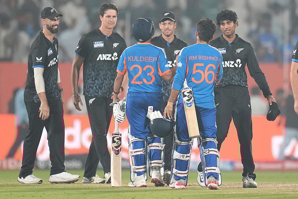 | Photo: AP/Aijaz Rahi : Indias Kuldeep Yadav and Indias Ravi Bishnoi congratulates New Zealand players after New Zealand won fourth T20 cricket match against India in Visakhapatnam.