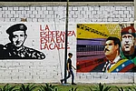 | Photo: Imago/Zuma Press Wire : Leaders on the Wall: A man walks past grafitti in Valencia city, Venezuela, depicting Nicolás Maduro, Simón Bolivar and Hugo Chávez