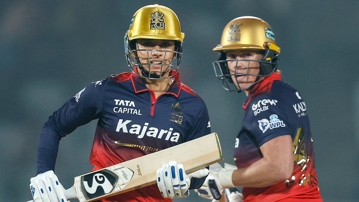 BCCI via PTI Photo : Royal Challengers Bengalurus captain Smriti Mandhana and Grace Harris in action during their Womens Premier League 2026 match against UP Warriorz, at BCA Stadium in Vadodara.
