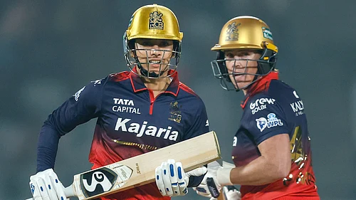 BCCI via PTI Photo : Royal Challengers Bengalurus captain Smriti Mandhana and Grace Harris in action during their Womens Premier League 2026 match against UP Warriorz, at BCA Stadium in Vadodara.