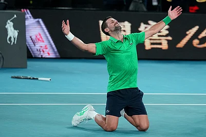 | Photo: AP/Dita Alangkara : Novak Djokovic of Serbia celebrates after defeating Jannik Sinner of Italy in their semifinal match at the Australian Open tennis championship in Melbourne, Australia.