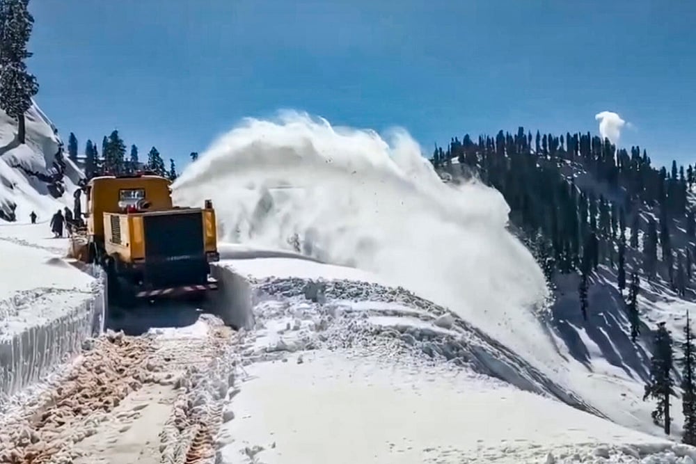 | Photo: PTI : A machine being used by Border Roads Organisation (BRO) to clear snow from Budhal-Mahore-Gool road, in Rajouri, Jammu and Kashmir.