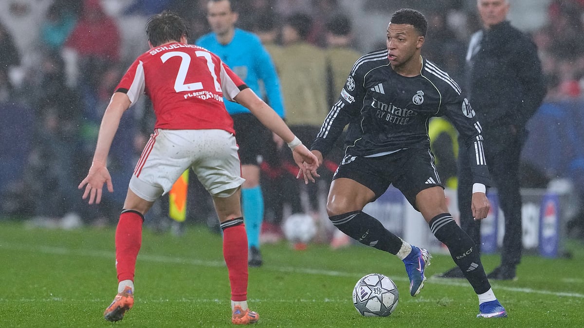 | Photo: AP/Armando Franca : Real Madrids Kylian Mbappe, right, vies for the ball with Benficas Andreas Schjelderup during a Champions League opening phase soccer match between Benfica and Real Madrid, in Lisbon, Wednesday, Jan. 28, 2026.