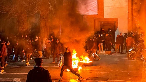 |Source: IMAGO / Middle East Images : Iranians gather while blocking a street during a protest in Tehran, Iran on January 9, 2026. The nationwide protests started in Tehrans Grand Bazaar against the failing economic policies in late December, which spread to universities and other cities, and included economic slogans, to political and anti-government ones