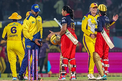 | Photo: BCCI via PTI : Royal Challengers Bengalurus captain Smriti Mandhana and teammate Richa Ghosh shake hands with UP Warriorz players after their victory during a Womens Premier League (WPL) 2026 T20 International cricket match between Royal Challengers Bengaluru and UP Warriorz, at BCA Stadium, in Vadodara, Gujarat.