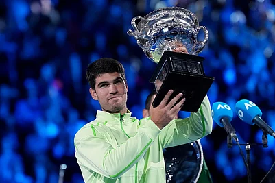 | Photo: AP/Aaron Favila : Carlos Alcaraz of Spain holds the Norman Brookes Challenge Cup after defeating Novak Djokovic of Serbia in the mens singles final at the Australian Open tennis championship in Melbourne, Australia.