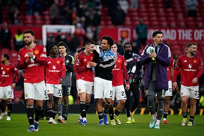 | Photo: AP/Dave Thompson : Manchester United players celebrate at the end of the English Premier League soccer match between Manchester United and Fulham in Manchester, England.