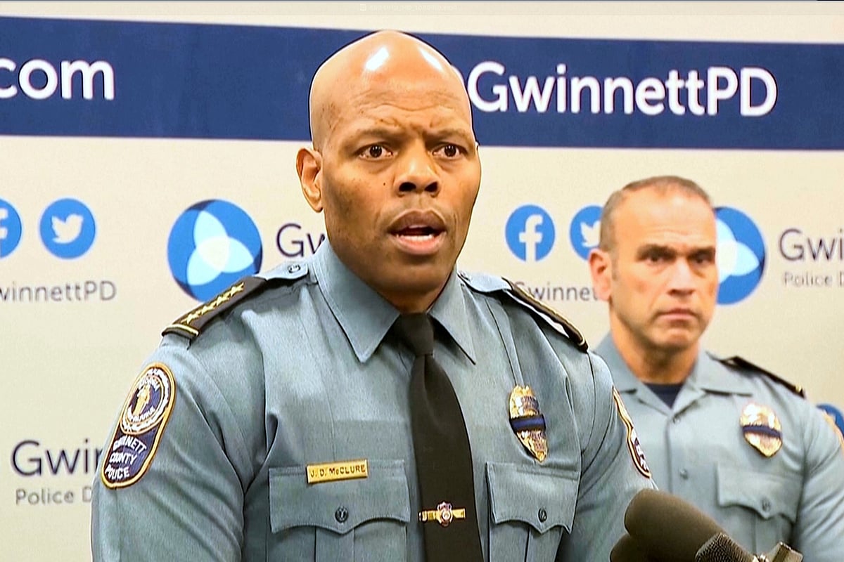 (WSB via AP) : An image taken from WSB video shows Gwinnett County Police Chief J.D. McClure speaks at a news conference Sunday, Feb. 1, 2026, in Gwinnett County, Ga., following the shootings of two officers at a hotel. 