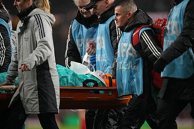 | Photo: AP/Alastair Grant : Arsenals goalkeeper Anneke Borbe is carried on a stretcher after getting injured in a collision with teammate Lotte Wubben-Moy during the Womens Champions Cup final soccer match between Arsenal FC and SC Corinthians in London.